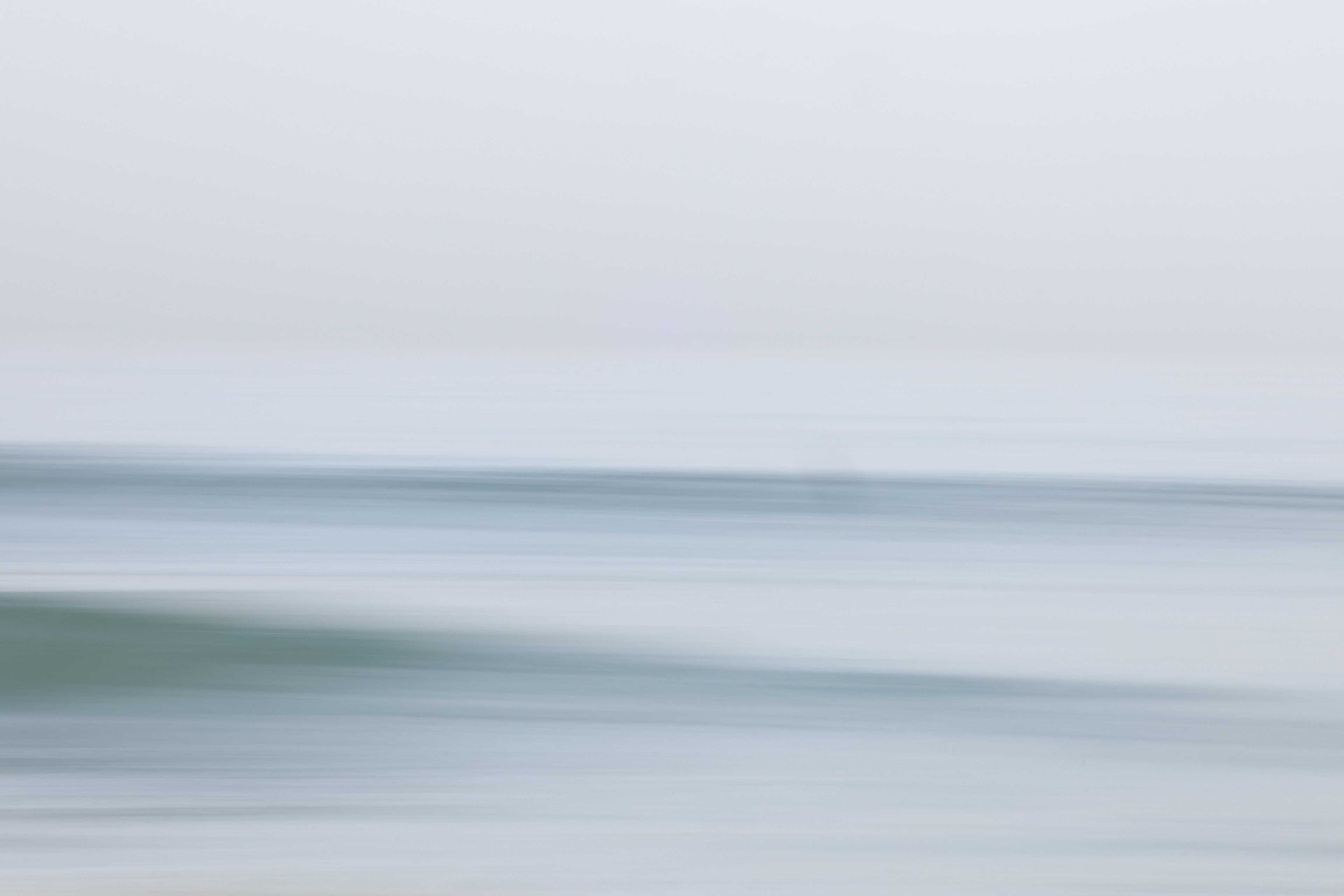 Soft motion blur seascape with muted blue and gray tones